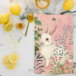Pimlada Phuapradit Backyard Bunny Cutting Board - Deny Designs